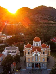 Photo of Megali Panagia taken at sunset with kink to the page